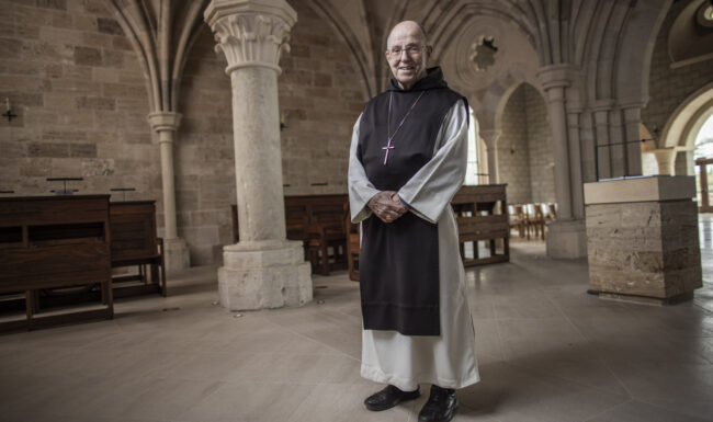 Smiling priest standing in the Abbey of Our Lady of New Clairvaux