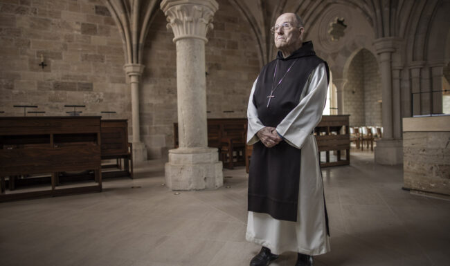 Priest standing in the Abbey of Our Lady of New Clairvaux