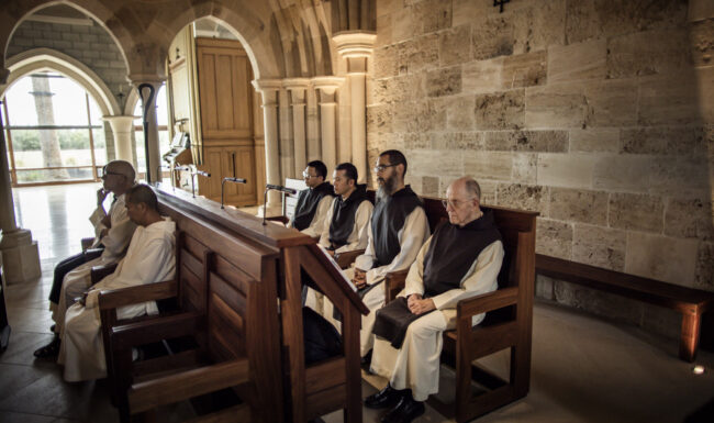 Monks sitting in the pews at the Abbey of Our Lady of New Clairvaux