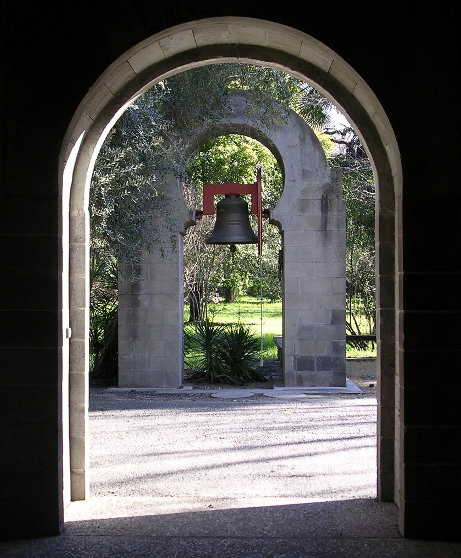 Bell tower as seen through corridor archway